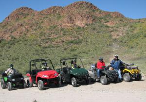 the arizona desert s queen valley, The Arizona team poses for the camera at a scenic stop