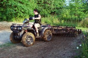 reasons to ride your utility, We used a Polaris Sportsman 700 to help haul tools back to the track and pull a disc to groom the soil