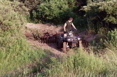 reasons to ride your utility, The Sportsman pulls through sweeping bermed corner