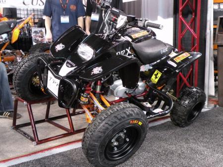 2009 dealer expo report, This DRX 50 Youth Quad from DRR was outfitted with products from Tarantula Performance Racing Elka shocks and Four Play A arms By the way all DRR Youth quads are compliant with the new anti lead legislation