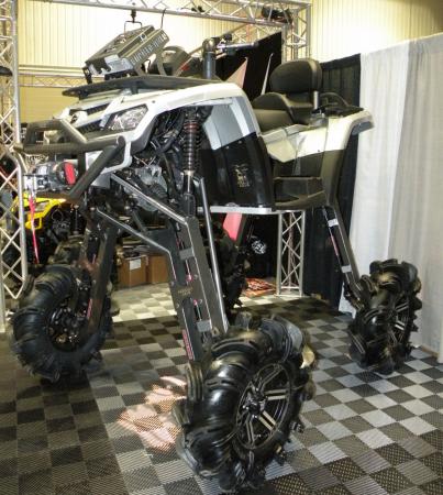 2009 dealer expo report, QUAD Magazine s booth was home to this insane mudder Fitted with enormous Gorilla Axles this Can Am Outlander was a sight to behold