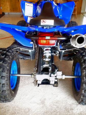 yamaha raptor 250 project part 3, Installation of the grab bar is very similar to the front bumper Simply remove the stock bolts remove the stock grab bar let s just say that wheelies got the best our stock bar position the DG grab bar and tighten the stock bolts back down
