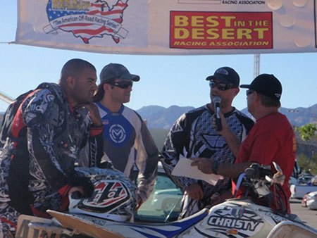 team christy earns three championships in 2009, Steve Abrego Andy Lagzdins and Craig Christy on the podium at the Primm GP