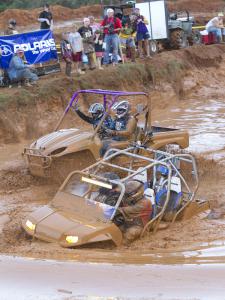 2010 high lifter mud nationals report, The four seater on the right plows through the deep and dirty