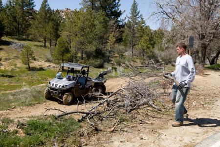 yamaha working to keep trails open, Steve Nessl Yamaha s Marketing Manager participates in a project to help prevent unauthorized trails from developing Called slashing this entails using downed trees and brush to block off any newly developing trails appearing in the surrounding area