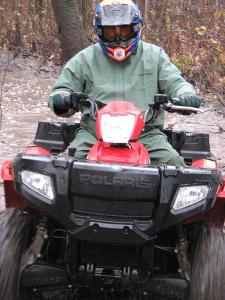 2008 polaris sportsman 500 efi x2 review, ATV guide and test rider Les Pinz pushes the Polaris hard through a mud pool