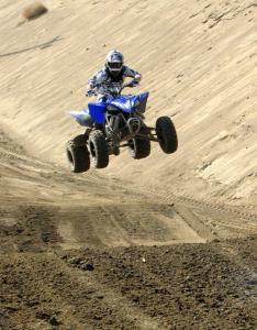 2009 yamaha yfz450r review, The YFZ450R easily powers over the doubles on the motocross track