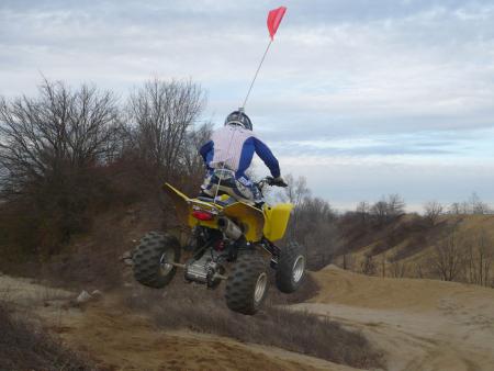2009 suzuki quadsport z400 review, Landing jumps isn t so hard on the body thanks to a plusher suspension