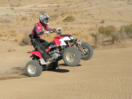 2009 polaris outlaw 525 irs review, With the fantastic low end torque it s a breeze to get the wheels up
