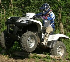 2009 suzuki kingquad 750 power steering review, Suzuki s power steering system reduces feedback to the handlebars from logs rocks and other trail obstacles