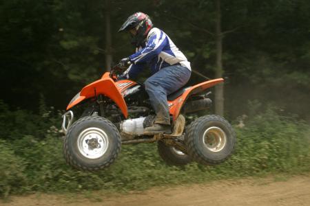 2009 kymco mongoose 300 review, The peppy 270cc mill provides enough power to get all four wheels off the ground