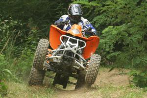 2009 kymco mongoose 300 review, Lifting up the front wheels is possible but it s not easy