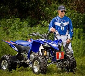 2010 yamaha yfz450x preview, Bill Ballance stands next to the ATV bearing his name