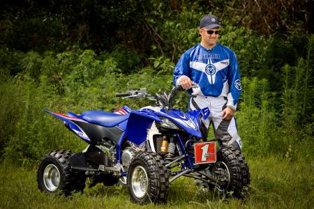 2010 yamaha yfz450x preview, Bill Ballance stands next to the ATV bearing his name