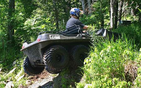 2009 argo avenger 750 review, Even with several wheels suspended in the air the Argo still has traction enough to move forward