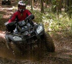 2010 kymco mxu 500 irs 44 le review, A muddy rutted out off camber trail was no trouble for the MXU 500