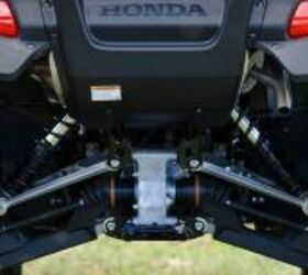 2010 honda fourtrax rincon review, Fully independent suspension offers 10 inches of ground clearance but the shocks lack preload adjustability