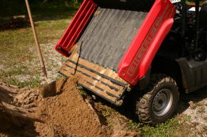 2010 honda big red muv review, Channels cut into tailgate held on to a bit of the dirt we were hauling around