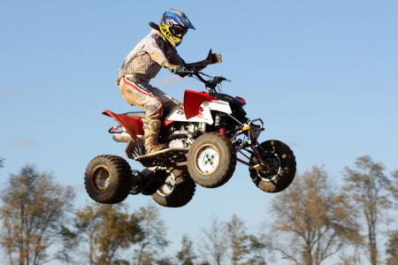 2010 450cc motocross shootout part 2, The Outlaw is the least expensive ATV in this shootout You ll have to use some of the money you save on aftermarket products to catch up the rest of this field