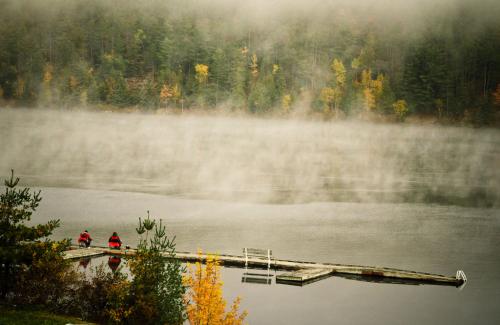 fall atv riding in ontario s near north, Two fishermen were casting their lines as the morning fog lifted off the Ottawa River