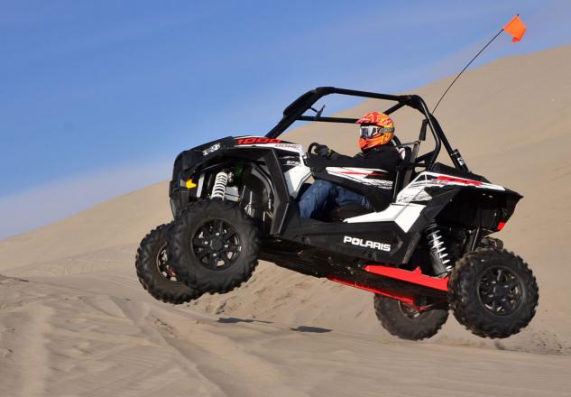 2014 polaris rzr xp 1000 review, 2014 Polaris RZR XP 1000 Action Jump Left