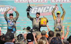 mcgill holds off fowler to win powerline park gncc, Walker Fowler left and Chris Bithell right celebrate on the XC1 podium with race winner Adam McGill