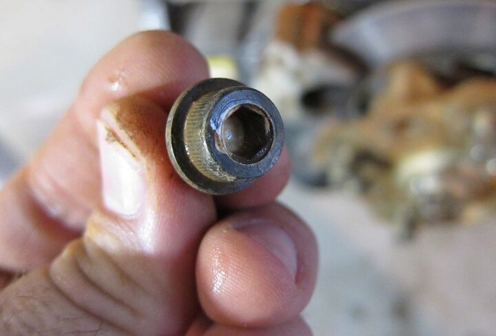 how to replace wheel hub bearings, Brake Caliper Nut