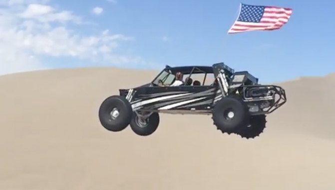 sand car catching huge air in slow motion video