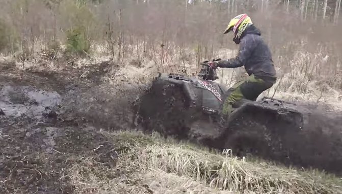 polaris sportsman 1000 taking on some serious ruts video