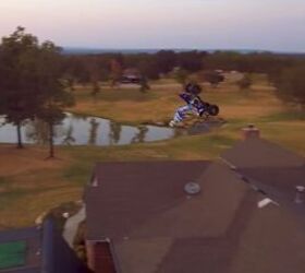 atv rider backflips over a house video