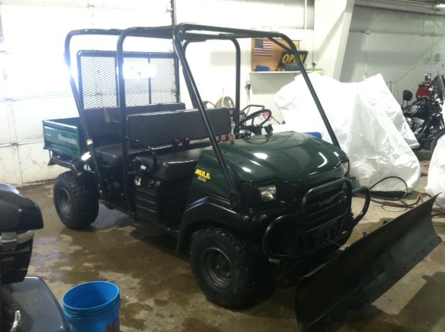 clean strong running kawasaki diesel mule 3010 trans w plow that was just freshly