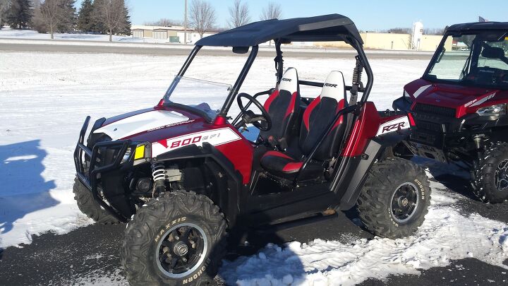 good used rzr 800 s in rally red this unit has 1 2 windshield roof rear view