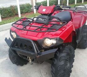 750cc v twin has aftermarket tires winch and brush