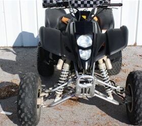 very clean kawasaki atv with reverse low hours and ready for the trails or the