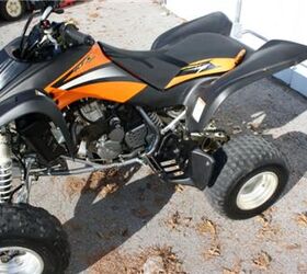 very clean kawasaki atv with reverse low hours and ready for the trails or the