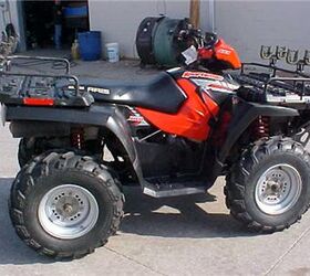 2005 polaris sportsman 700 efi with front rear rack extenders gun mounts front