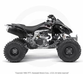 this quad is very clean and has a yoshimura exhaust and handguards call for more