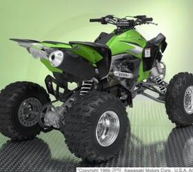 this quad is very clean and has a yoshimura exhaust and handguards call for more