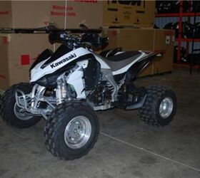 this quad is very clean and has a yoshimura exhaust and handguards call for more