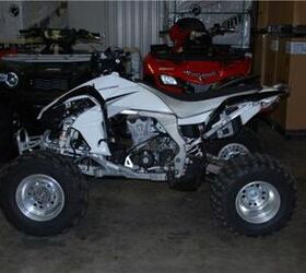 this quad is very clean and has a yoshimura exhaust and handguards call for more