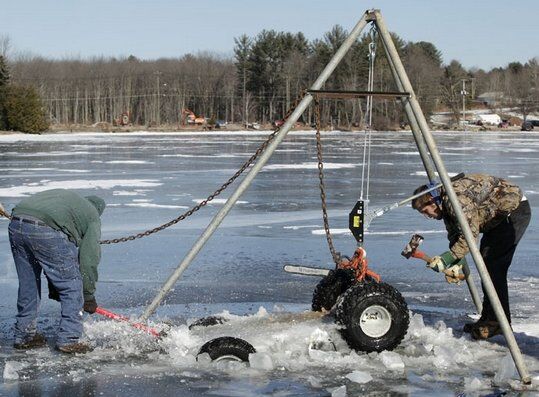 atv frozen in white lake