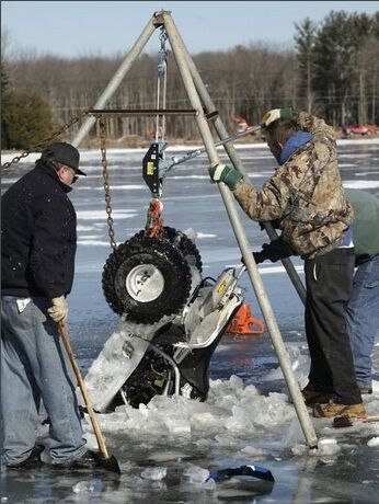 atv frozen in white lake