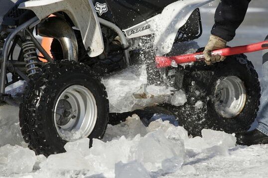 atv frozen in white lake