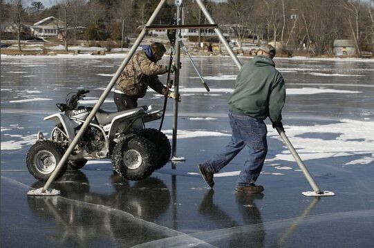 atv frozen in white lake