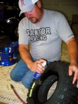 yamaha raptor 250 project part 2, There are a couple of options you have when lubing up the center of the tire to slip the wheel into place You can use a mixture of soap and water or you can just go with the Jack of all trades WD40