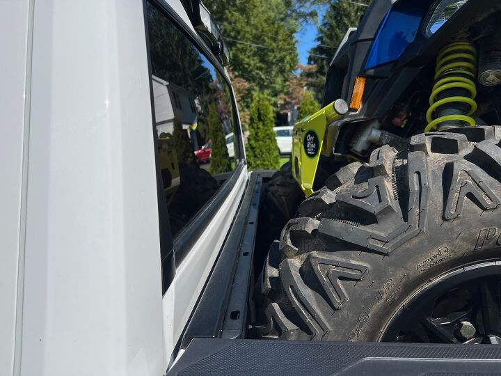 The truck seen here has a bedliner which serves as a barrier to help keep the ATV's front end away from the rear window. Even in cases like this, straps should be used to tie the ATV in place to prevent it from moving. Photo Credit: Ross Ballot