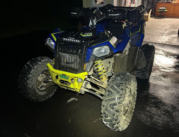 We don't recommend washing an ATV in a tropical storm, but heavy rain (sans lightning and thunder) can help get the job done if you're brave. Photo Credit: Ross Ballot